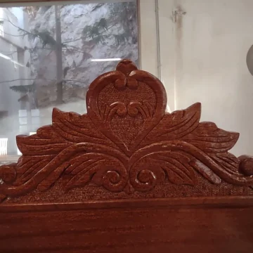 Intricate detail of an engraved wooden chair
